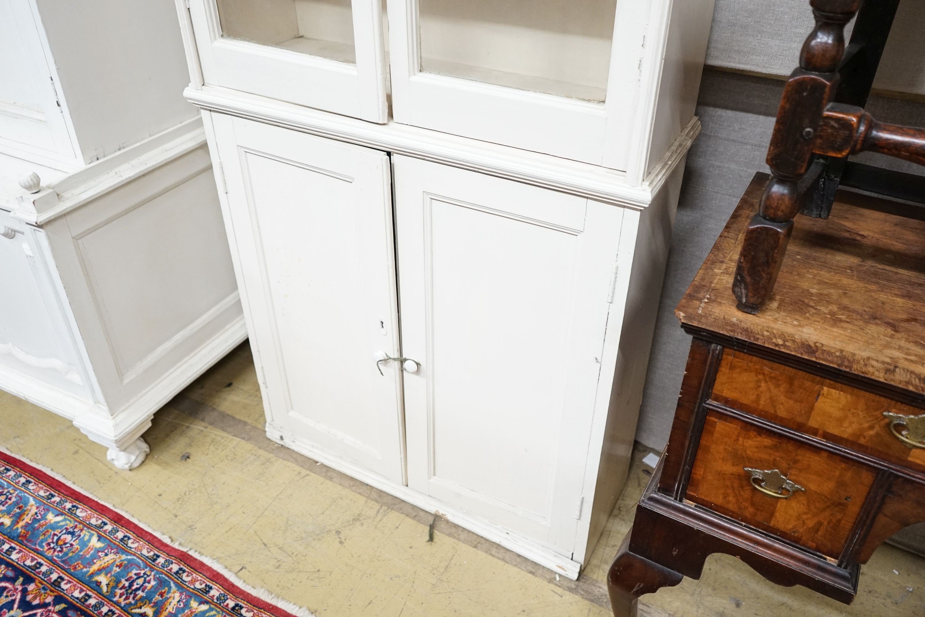 A Victorian style painted pine narrow glazed kitchen cabinet, width 83cm, depth 29cm, height 242cm